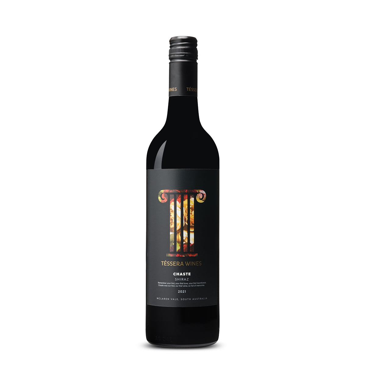 A bottle of Téssera Wines Chaste Shiraz 2021 from McLaren Vale, with a striking label featuring Roman numeral-inspired branding in front of a blazing fire motif, symbolizing the traditional winemaking techniques used to create this bold vintage.