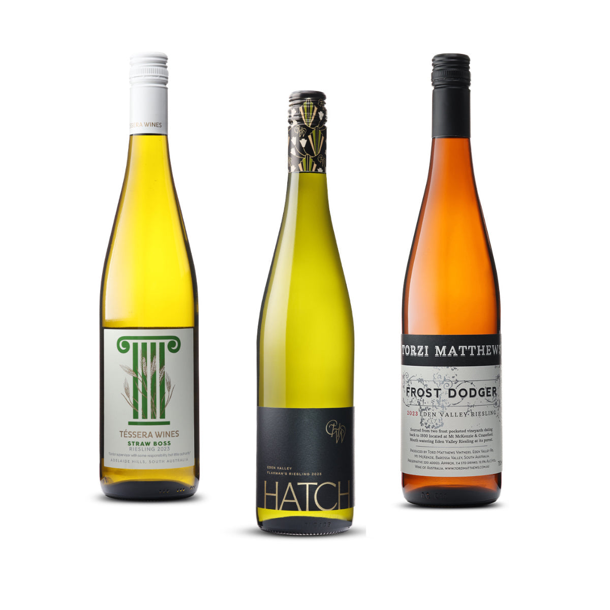 Three bottles of Riesling from the Riesling Lovers Mixed Pack, featuring Tozi Matthew Frost Dodger Riesling, Hatch Wines Eden Valley Flaxmans Riesling, and Téssara Straw Boss Riesling. Buy white wine online at Wine Simple.