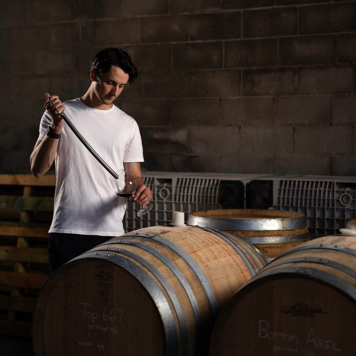 Harry Scanlon of Scanlon Wines, barrel tasting is Pinot Noir at the Winery in the Adelaide Hills Wine Region of Australia.