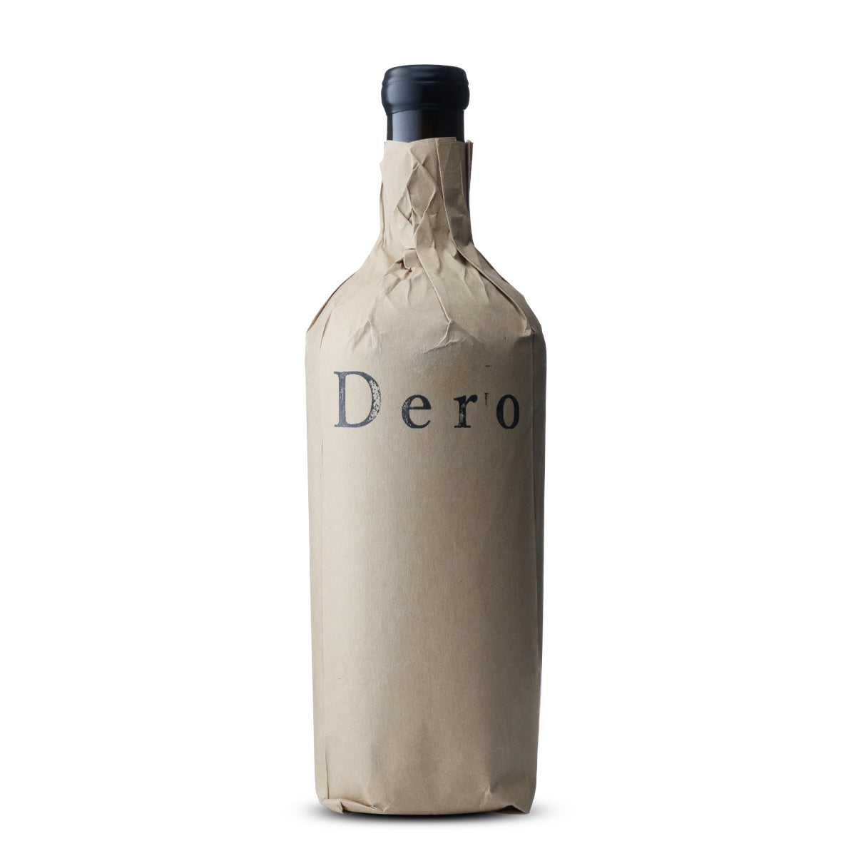 A bottle of wine with a black cap is wrapped in a crinkled brown paper bag. The bag is labeled with the word 'Dero' in a large, serif font, centrally placed. The background is plain white, emphasizing the simplicity and mystery of the concealed bottle