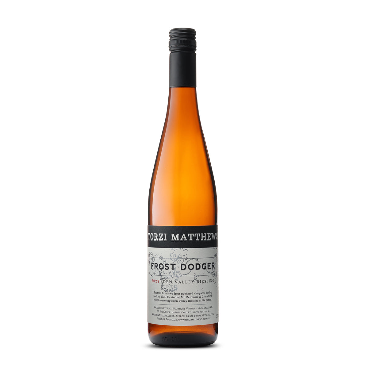 A bottle of 2023 Torzi Matthews Frost Dodger Riesling with a distinct orange-amber color. The central label is black with white and gray text detailing the wine’s name, vintage, and Eden Valley origin, along with winemaking practices and 12.5% alcohol content. The presentation suggests a premium, carefully crafted wine.