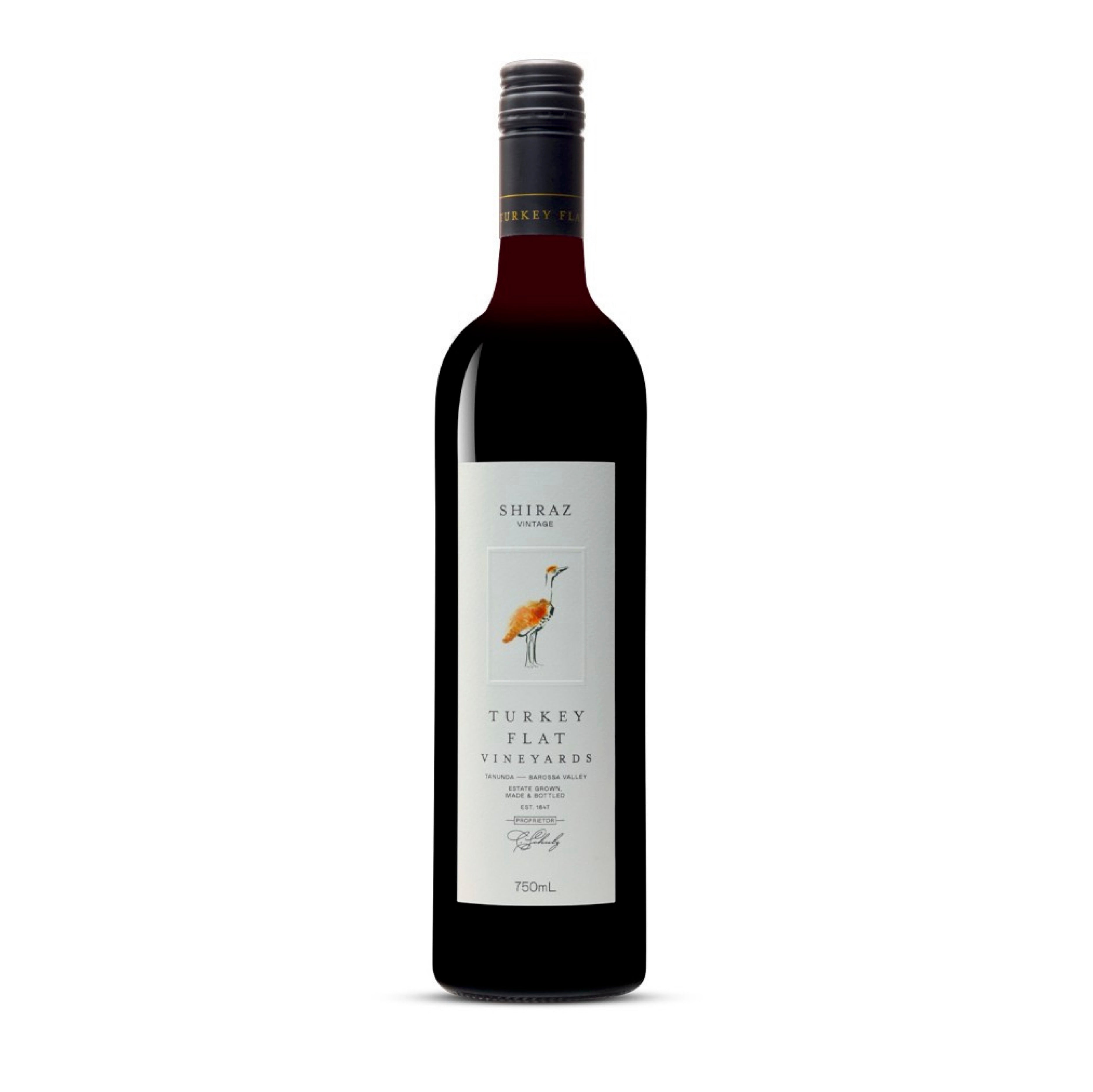 Wine bottle with label saying Turkey Flat Shiraz Barossa Valley Wine on a white background with image of a turkey on the front.